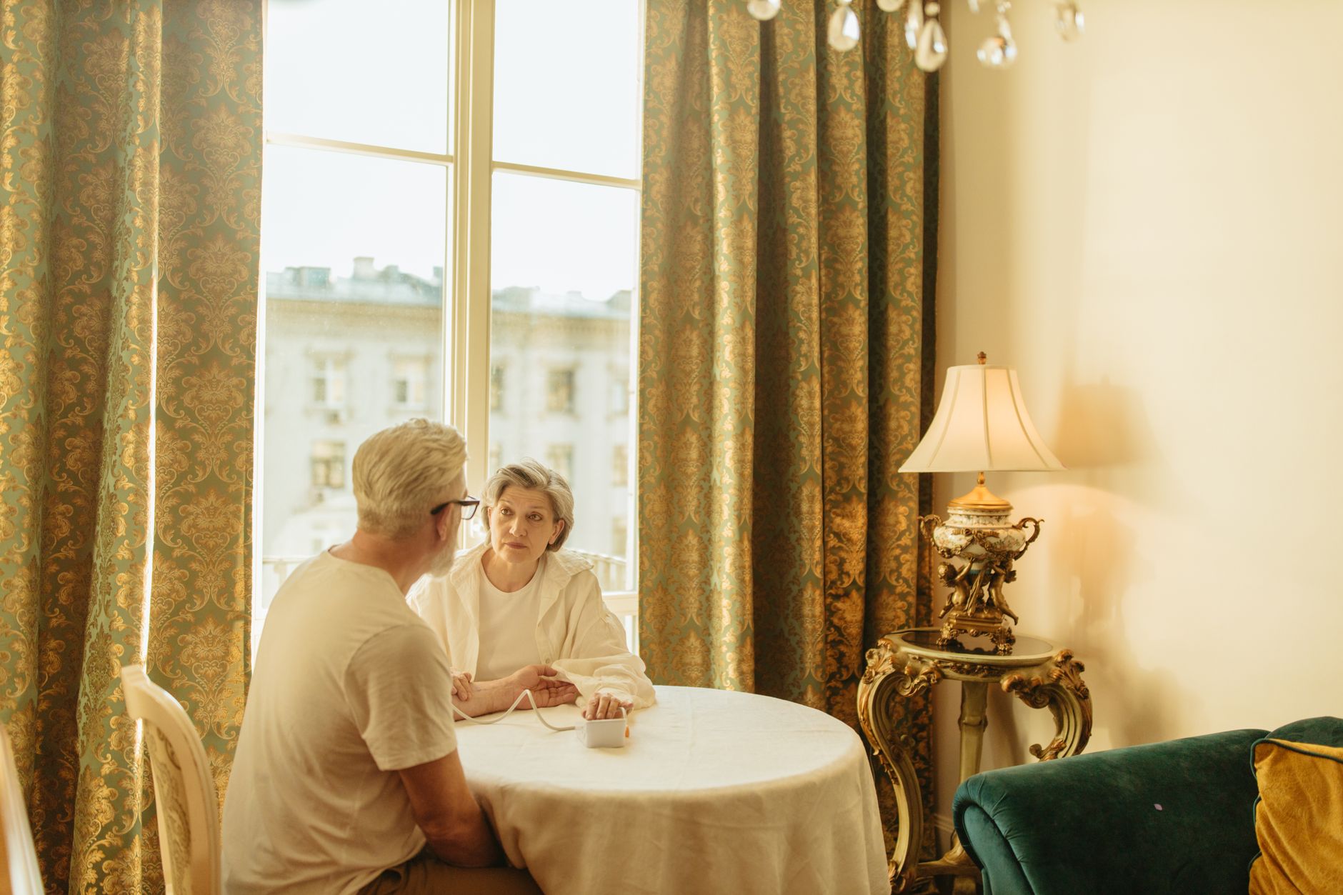 Patient discussing a telehealth primary care visit with family in Massachusetts